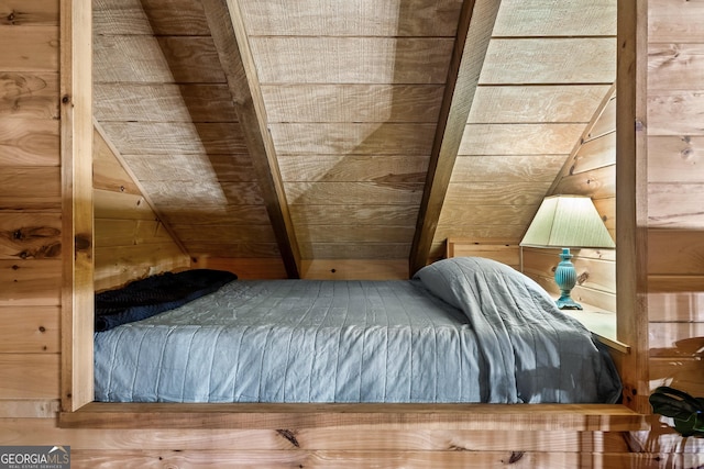 unfurnished bedroom with wooden ceiling and wooden walls