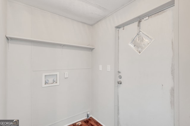 laundry area featuring washer hookup and dark hardwood / wood-style flooring