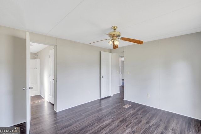 spare room with ceiling fan and dark hardwood / wood-style floors