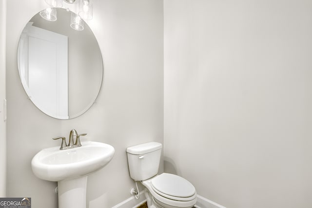 bathroom with toilet and sink