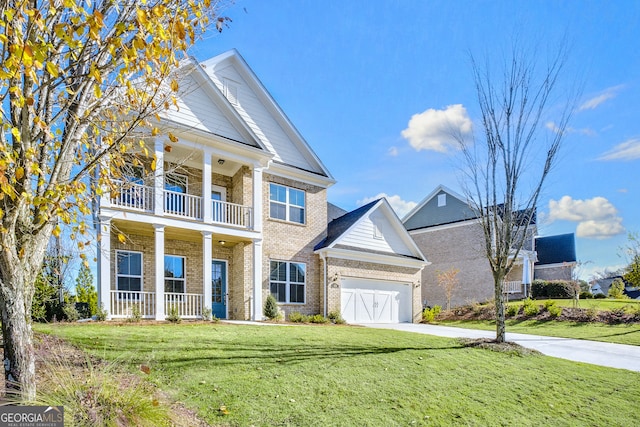 neoclassical / greek revival house with a balcony, a front lawn, and a porch