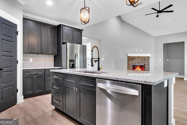 417 Lakeview Pl, Macon, GA 31211 - kitchen featuring appliances with stainless steel finishes, a sink, ceiling fan, light wood-type flooring, and recessed lighting