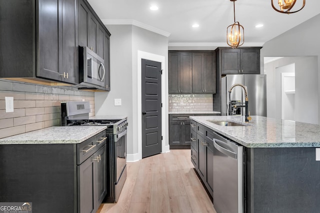 417 Lakeview Pl, Macon, GA 31211 - kitchen with appliances with stainless steel finishes, a sink, light wood-style floors, backsplash, and light stone counters