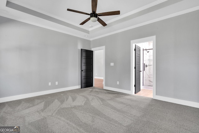 417 Lakeview Pl, Macon, GA 31211 - unfurnished bedroom with ornamental molding, carpet, baseboards, ensuite bathroom, and a raised ceiling