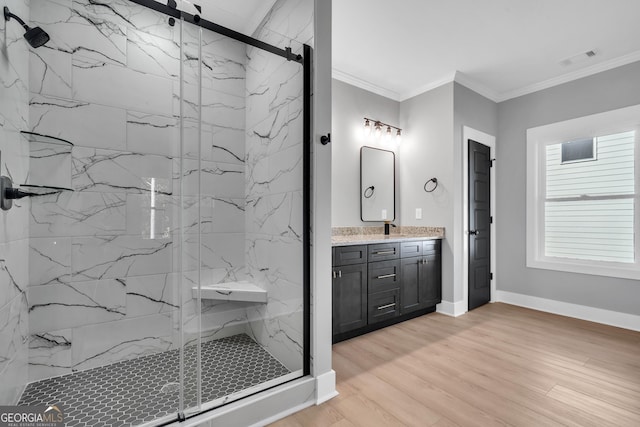 417 Lakeview Pl, Macon, GA 31211 - bathroom featuring a marble finish shower, crown molding, vanity, wood finished floors, and baseboards