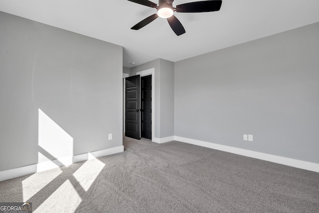 417 Lakeview Pl, Macon, GA 31211 - unfurnished bedroom featuring carpet, baseboards, a ceiling fan, and a closet