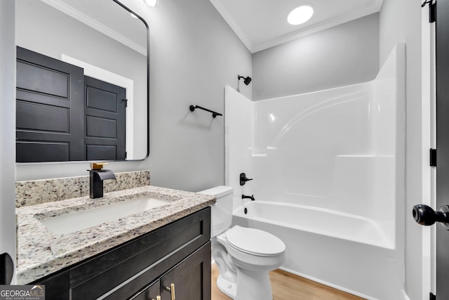 417 Lakeview Pl, Macon, GA 31211 - bathroom featuring crown molding, wood finished floors, toilet, shower / washtub combination, and vanity