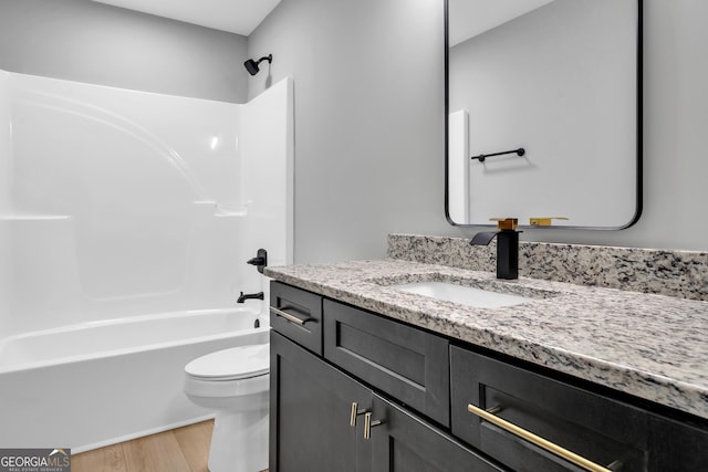 417 Lakeview Pl, Macon, GA 31211 - bathroom featuring wood finished floors, toilet, bathing tub / shower combination, and vanity