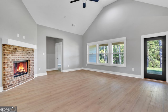 417 Lakeview Pl, Macon, GA 31211 - unfurnished living room with high vaulted ceiling, ceiling fan, light wood-style flooring, a fireplace, and baseboards