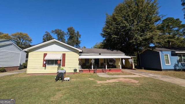 541 Lynmore Cir, Macon, GA 31206 - view of front of house with a front yard and a porch