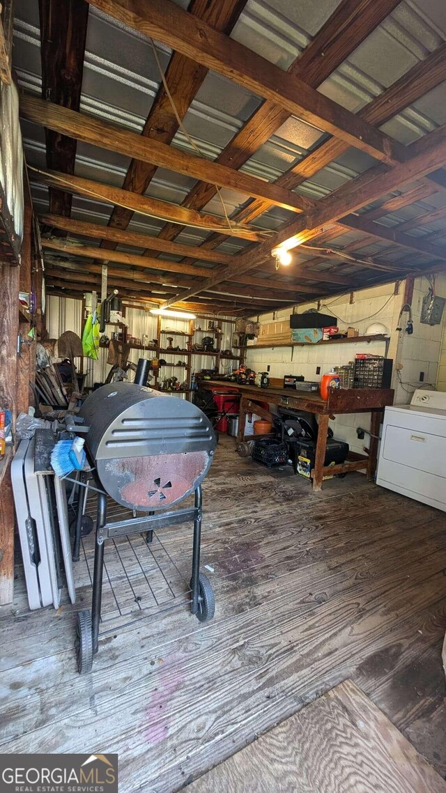 interior space with washer / dryer and a workshop area