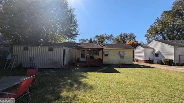 541 Lynmore Cir, Macon, GA 31206 - back of property featuring a lawn and a deck