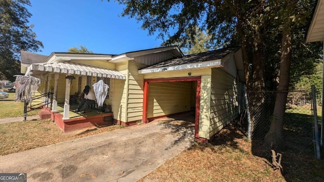 view of side of home with a carport