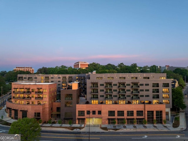 view of outdoor building at dusk