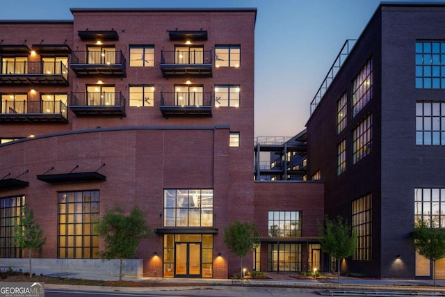 view of outdoor building at dusk