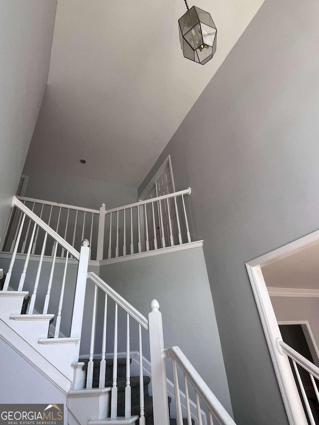 staircase with crown molding