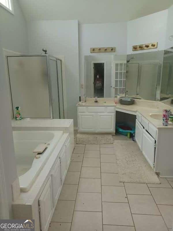 bathroom featuring vanity, separate shower and tub, and tile patterned flooring