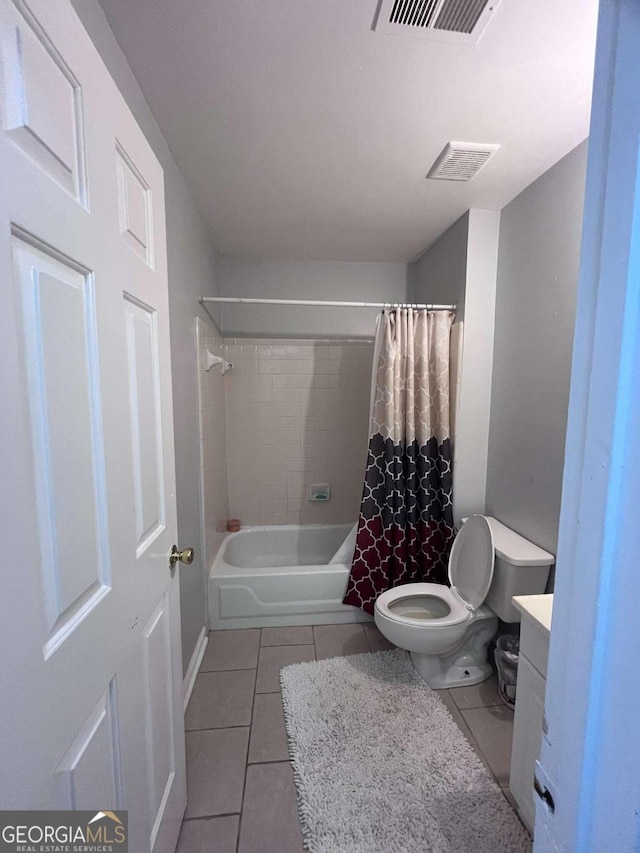 full bathroom with vanity, shower / tub combo, toilet, and tile patterned flooring