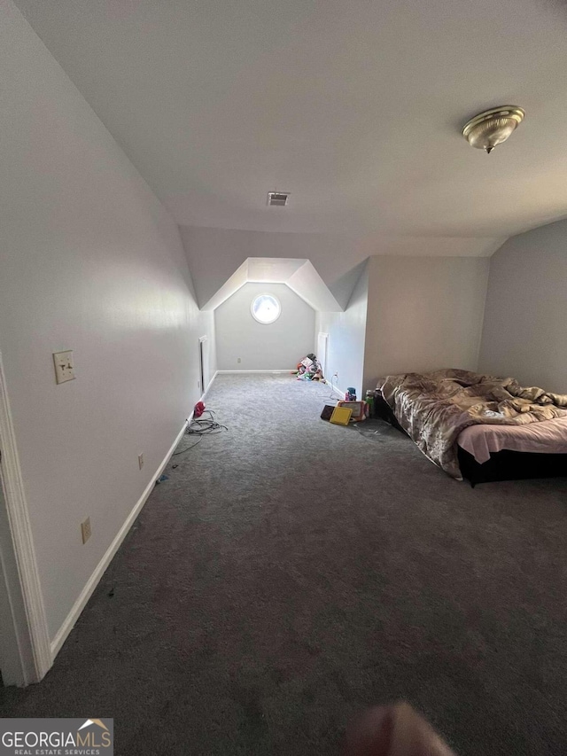 bonus room featuring carpet flooring and vaulted ceiling