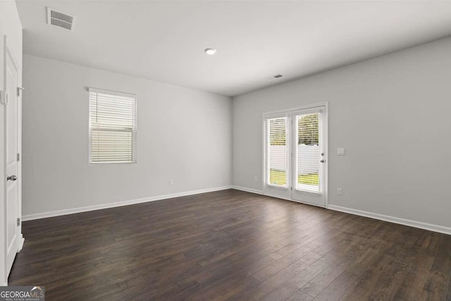 empty room featuring dark wood-type flooring