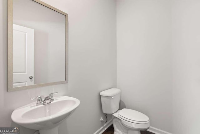 bathroom with toilet and sink