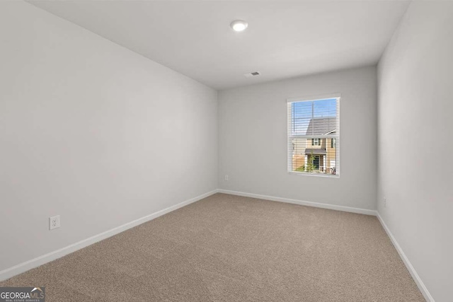 view of carpeted spare room