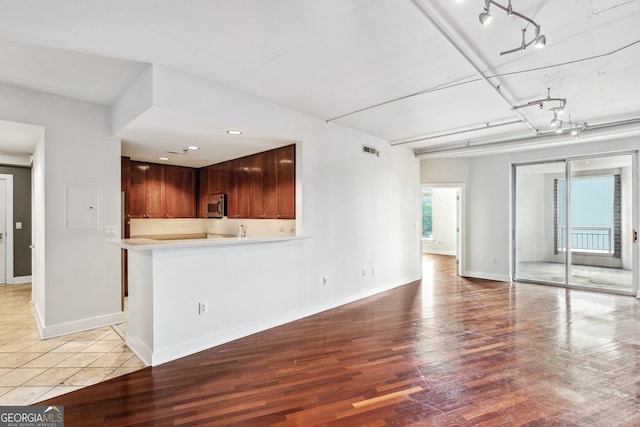 unfurnished living room with light wood-type flooring