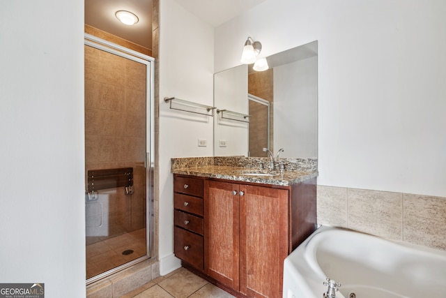 bathroom featuring vanity, shower with separate bathtub, and tile patterned flooring