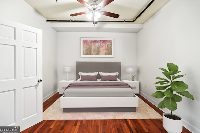 bedroom featuring hardwood / wood-style flooring and ceiling fan