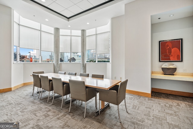 dining space featuring light colored carpet