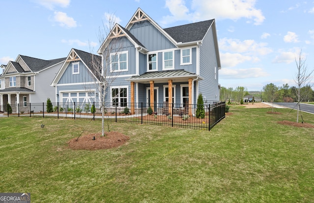 view of front of property featuring a front yard, covered porch, and a garage