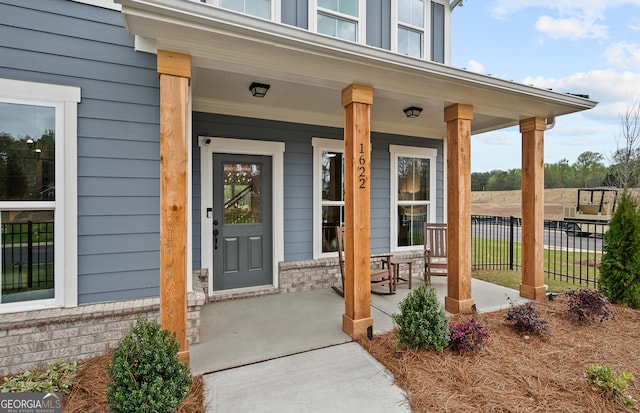 property entrance with covered porch