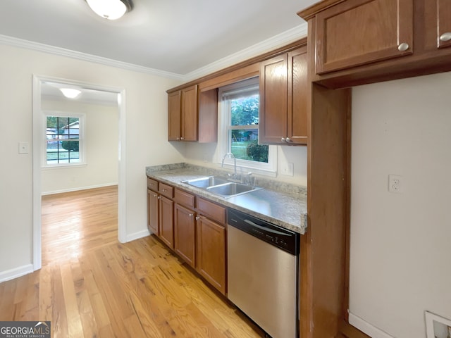 kitchen featuring stainless steel dishwasher, ornamental molding, sink, and light hardwood / wood-style flooring