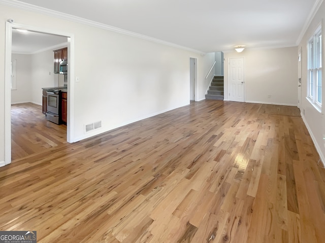 unfurnished living room with light hardwood / wood-style floors and crown molding