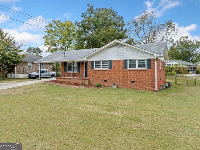 view of front of property featuring a front yard and central air condition unit