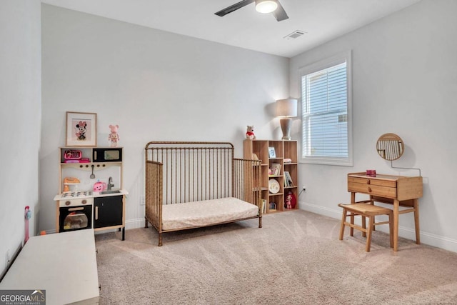 carpeted bedroom featuring ceiling fan