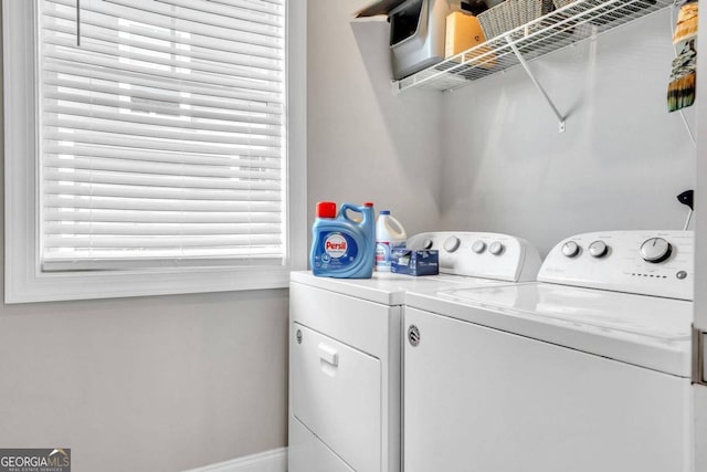 laundry room featuring washing machine and clothes dryer