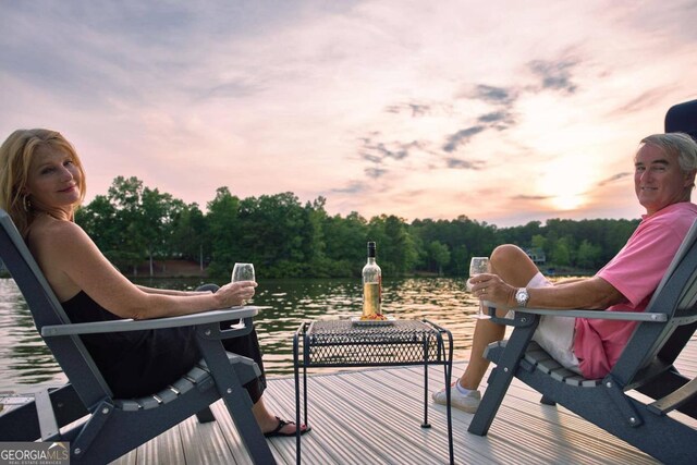 deck at dusk with a water view