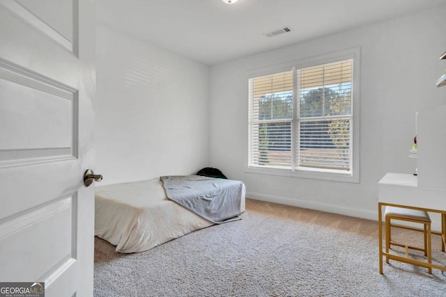 bedroom featuring carpet