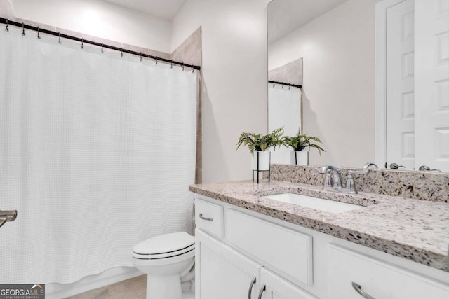 bathroom with vanity, a shower with curtain, and toilet