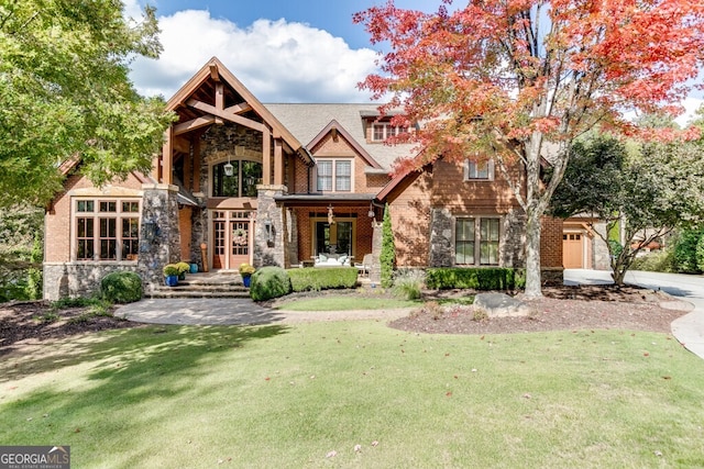 view of front of property with a garage and a front lawn