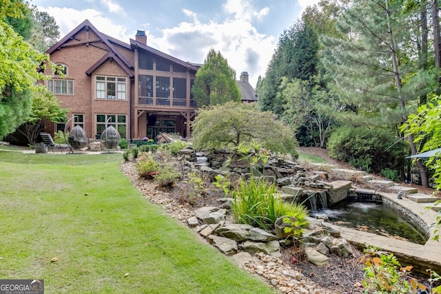 view of yard featuring a sunroom