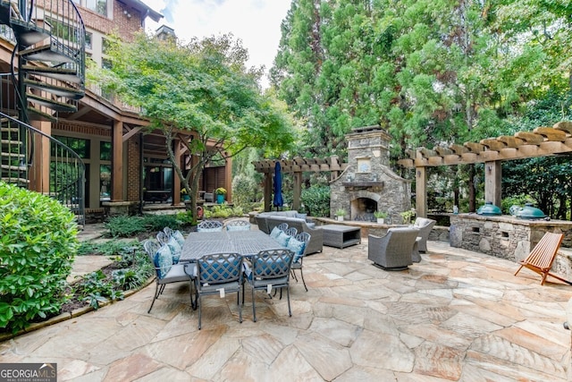 view of patio / terrace featuring an outdoor living space with a fireplace