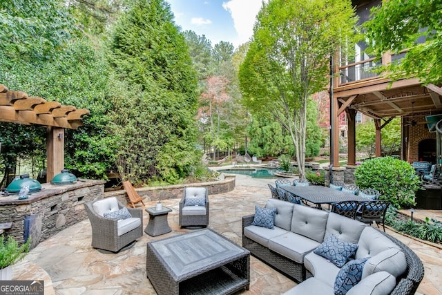 view of patio / terrace featuring a balcony and an outdoor living space