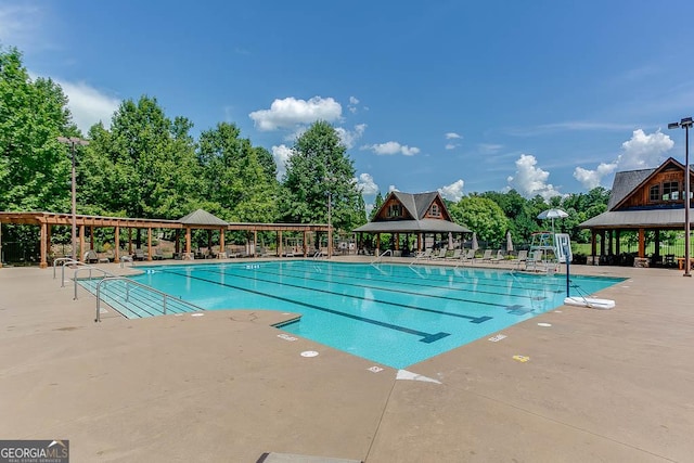 view of swimming pool featuring a gazebo and a patio area