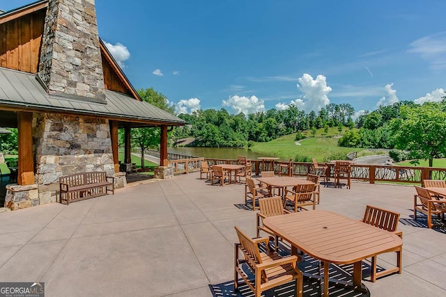 view of patio / terrace featuring a water view