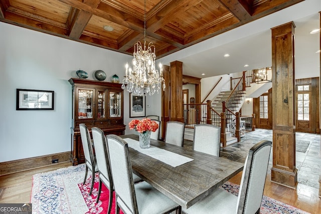 dining area with an inviting chandelier, coffered ceiling, wooden ceiling, and light wood-type flooring