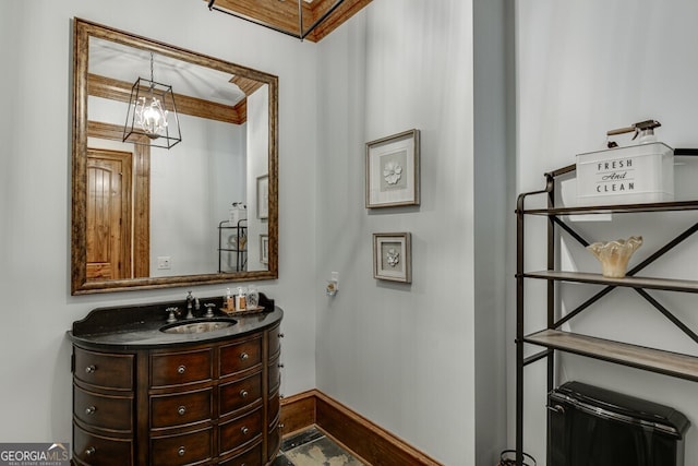 bathroom with vanity and crown molding