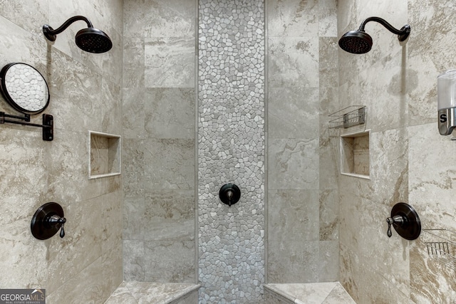 bathroom with tiled shower