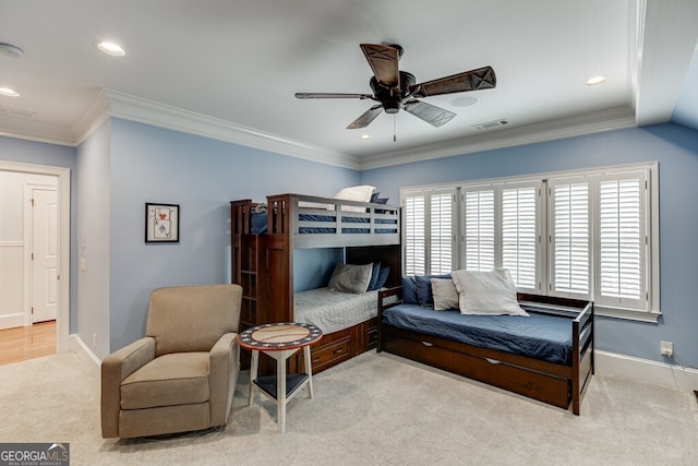 carpeted bedroom with ceiling fan and ornamental molding